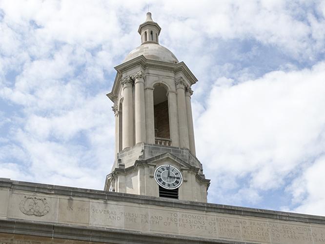 Old Main Bell Tower against Blue and White Sky